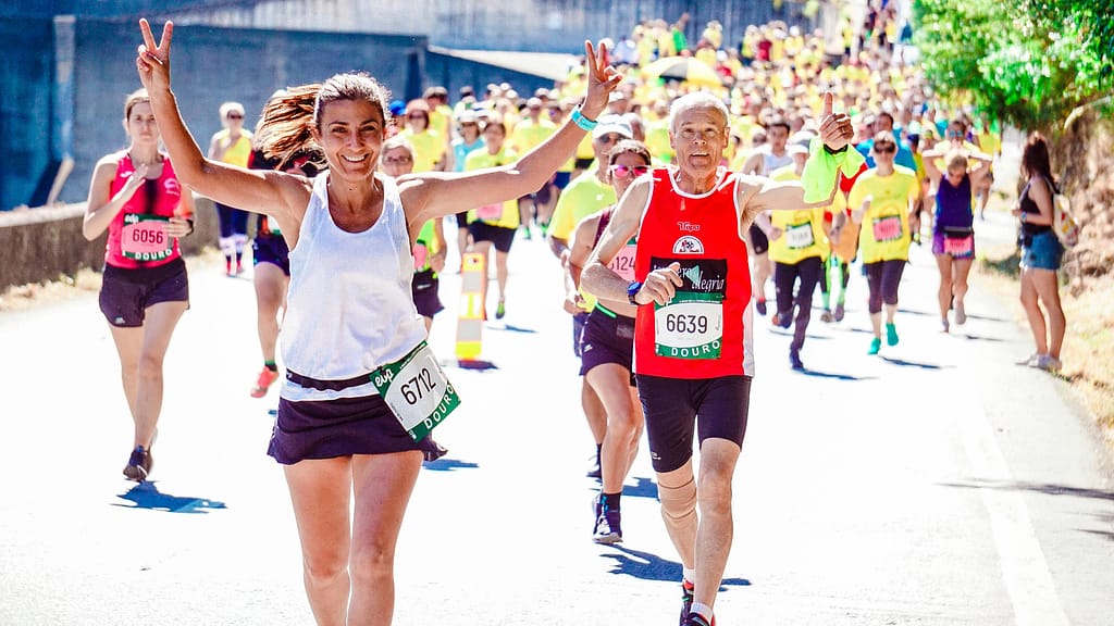 Two high level leadership members who are leading by example as they participate in a group exercise event.