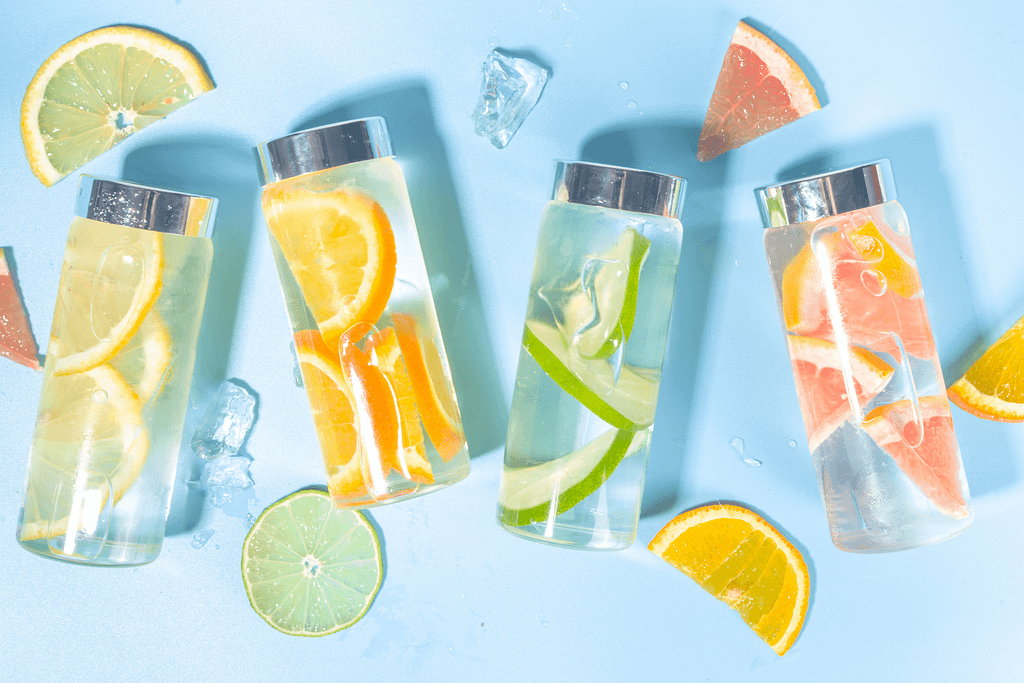 a fruit infused row of reusable water bottles