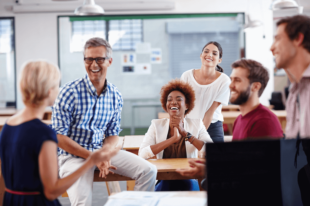 a group of happy employees loving the workplace culture