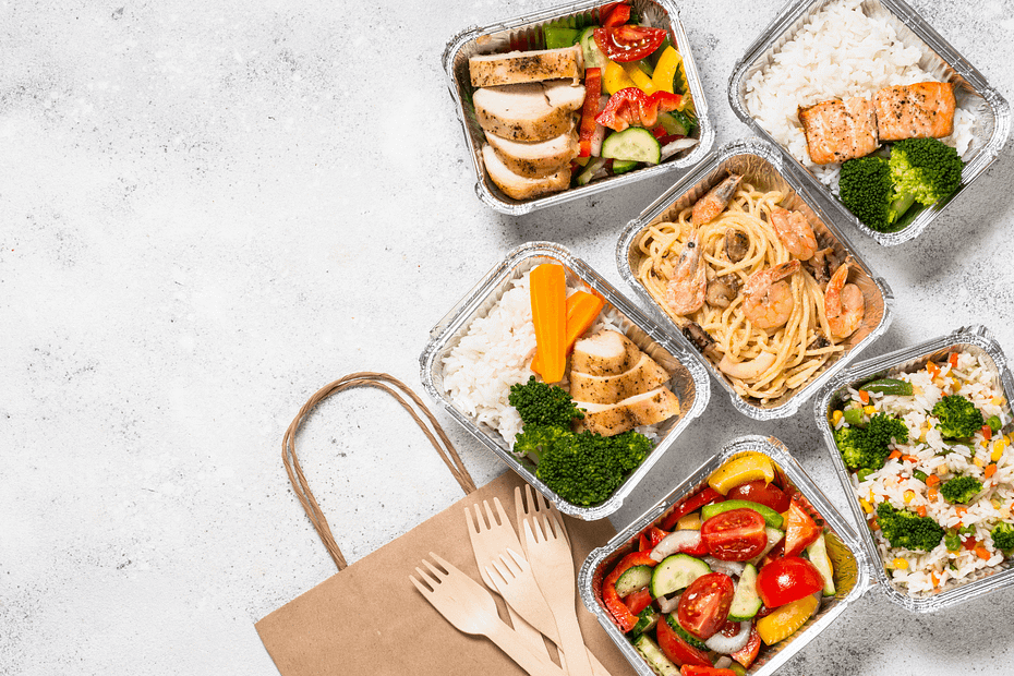 Healthy lunches in assorted containers, ranging from pasta and vegetables to shrimp, fish, and chicken, represent a company team participating in workplace nutrition. Healthier eating with workplace nutrition programs with practical meal tips, personal stop times, veggie challenges, and more.